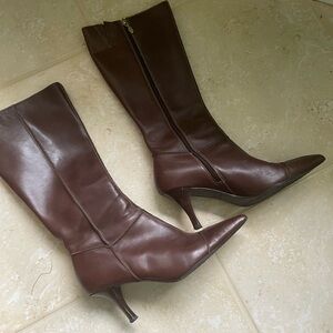 Knee high genuine leather high heel boots.